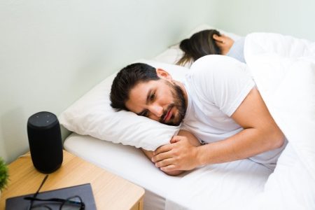 Man struggling with insomnia before starting sleep therapy for better rest